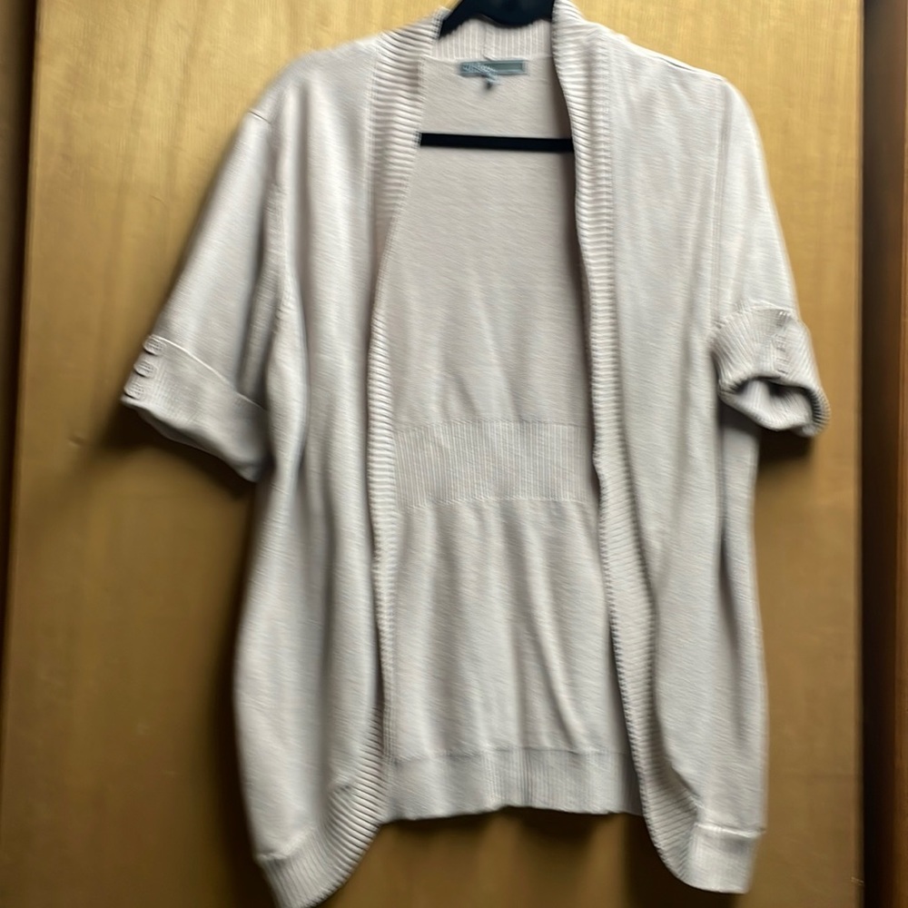 Women’s cream,tan shrug figure flattering. Cuffed sleeves almost to elbow